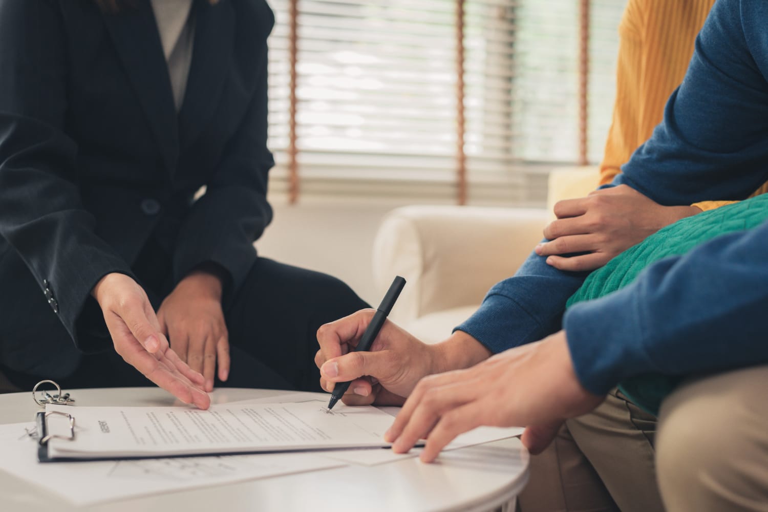 Young couple reviewing umbrella insurance guide
